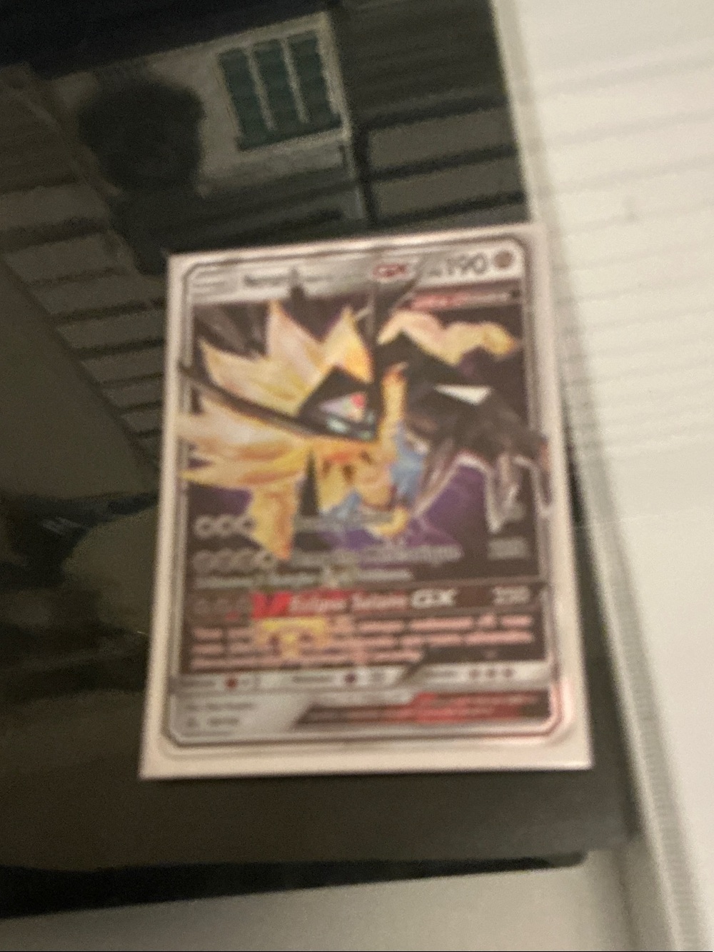 Solar-Type Pokémon GX Trading Card - Yellow & Black Artwork